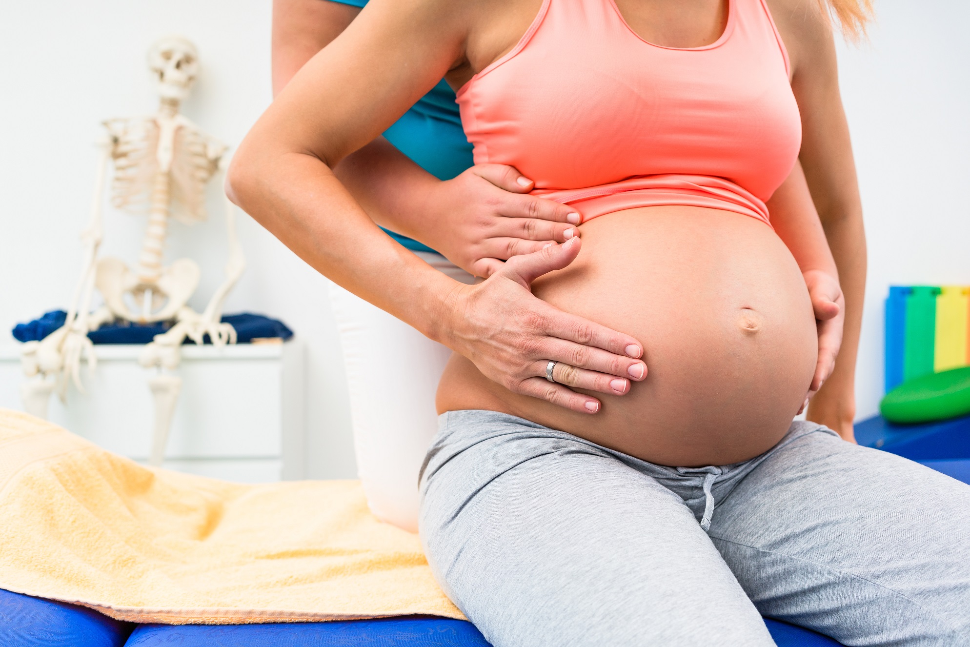 Woman receiving Pregnancy Chiropractic care from a pregnancy chiropractor